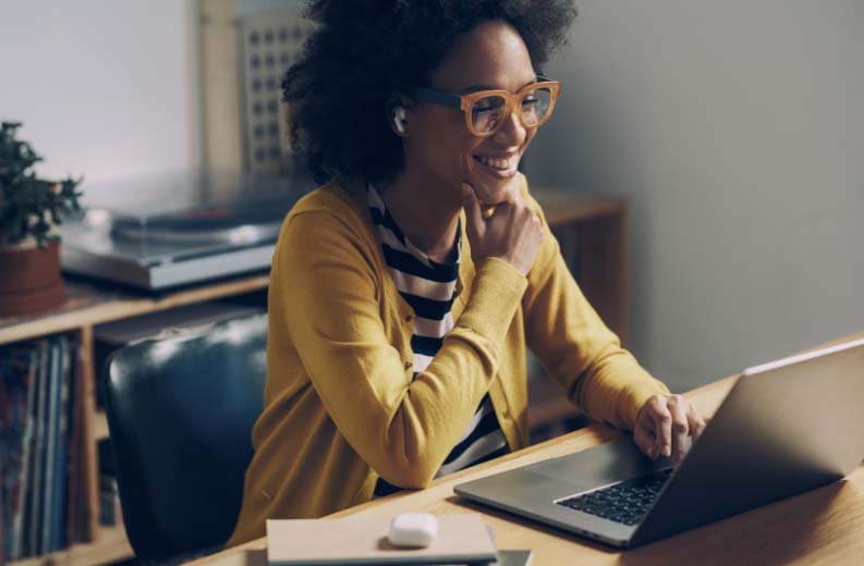Person working on laptop at desk